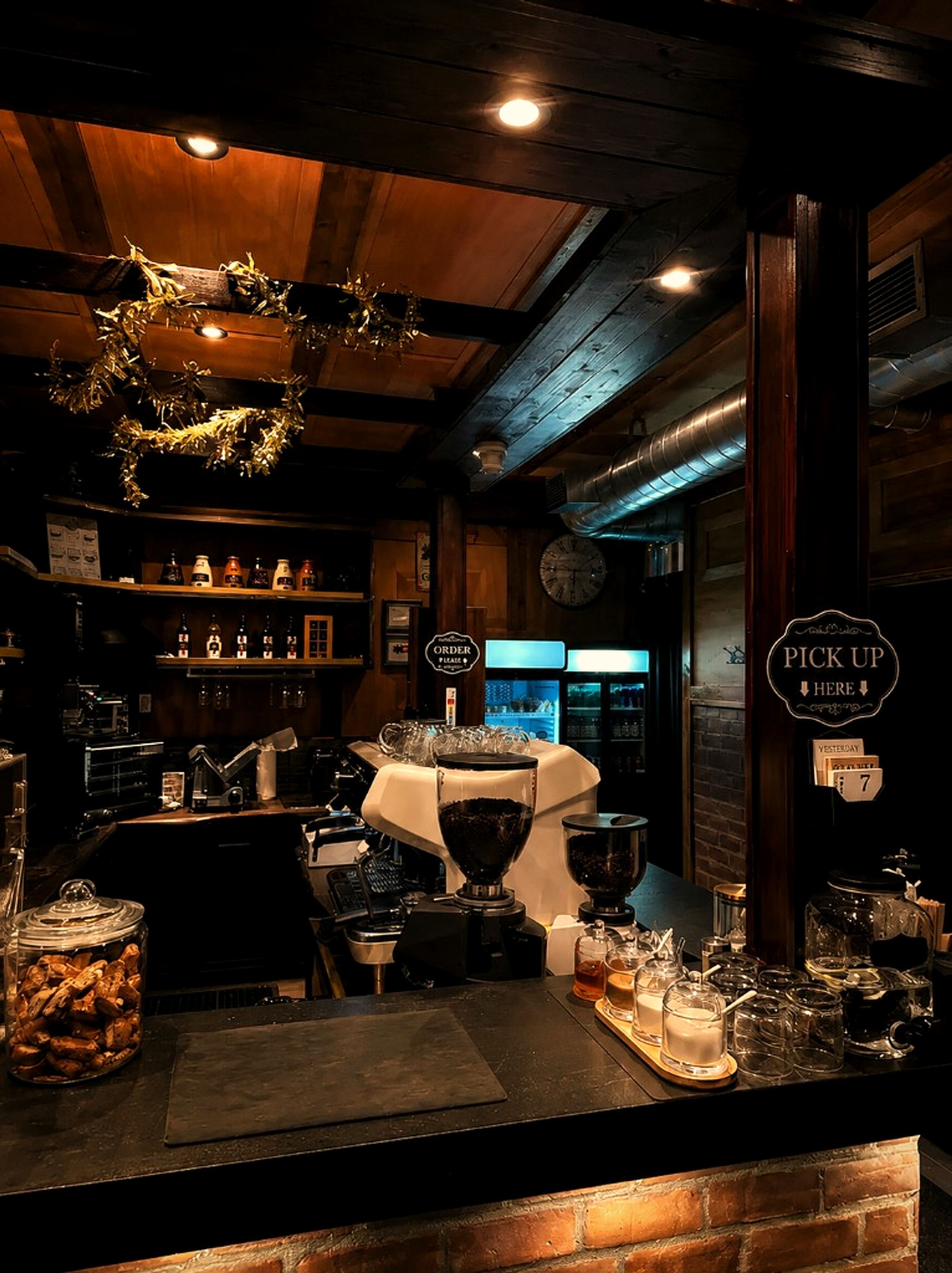 Coffee bar counter with espresso machine at One Gram Coffee Bar
