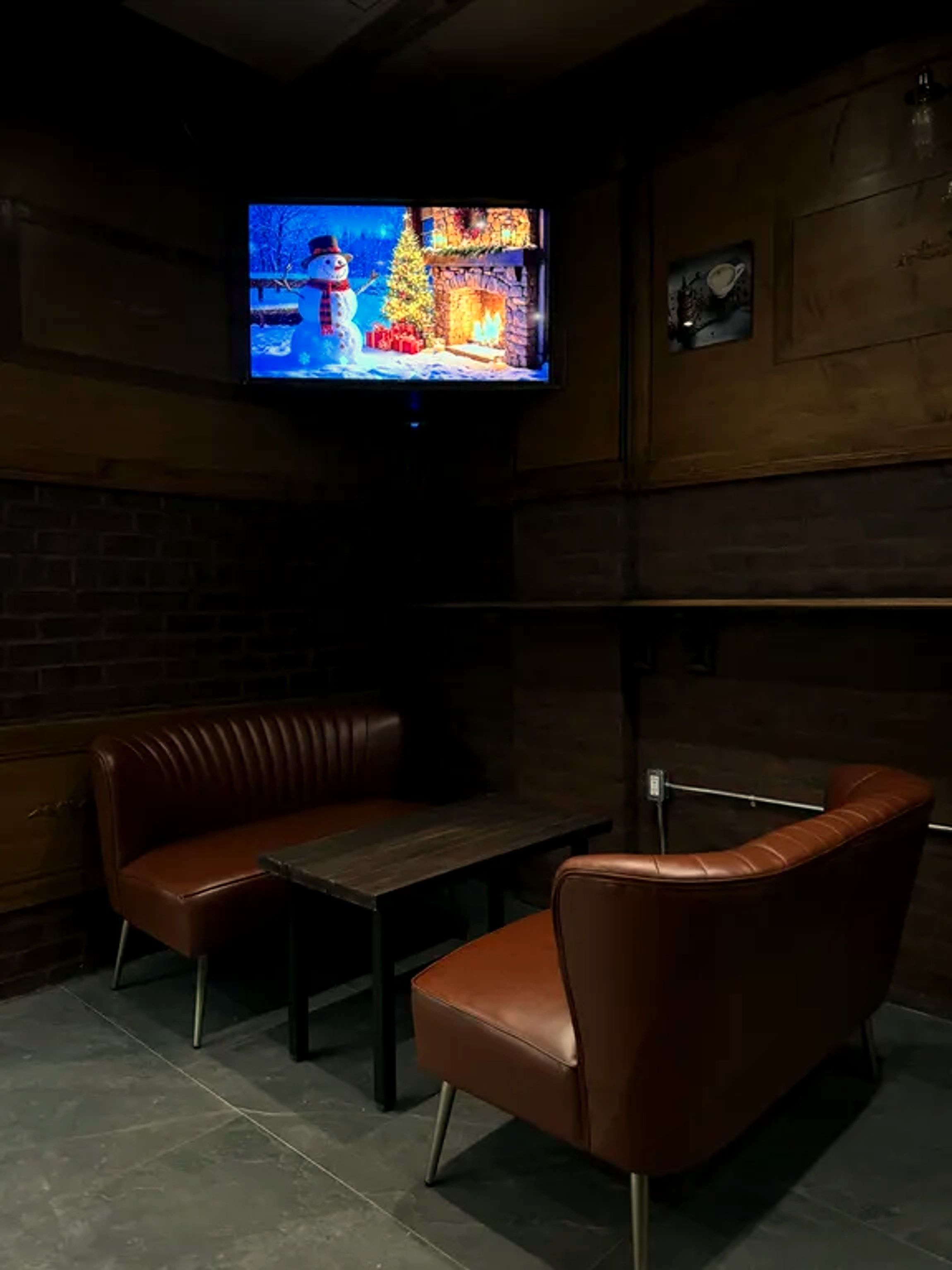 Cozy leather booth seating at One Gram Coffee Bar